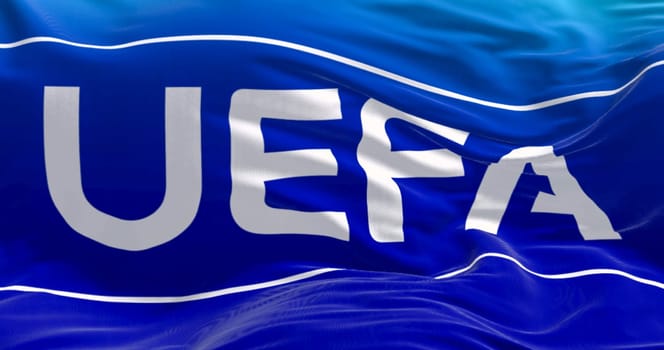 Nyon, CH, April 2023: Close-up of UEFA flag waving in the wind. UEFA is the association that manages professional football in Europe. Illustrative editorial 3d illustration render