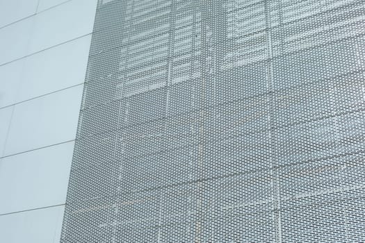 Steel wall of building. Grille on wall. Office building. Texture architecture.