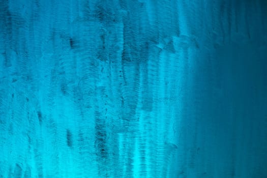Blue texture made of plastic. Scratches on plastic. Dirty surface. Blue background.