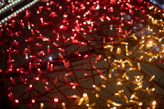 Red garlands. Texture made of LEDs. Bright lights. Decoration in city.