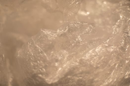 Texture of plastic bag. Transparent polyethylene. Crumpled film.