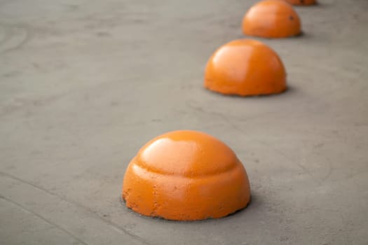 Parking areas. Orange spheres on road. Parking space closed. Motion Lock. Restriction for transport.