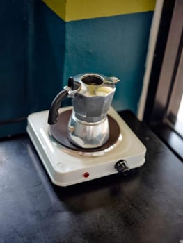An Italian coffee machine called a moka pot on stove