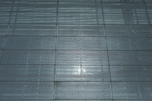 Steel wall of building. Grille on wall. Office building. Texture architecture.