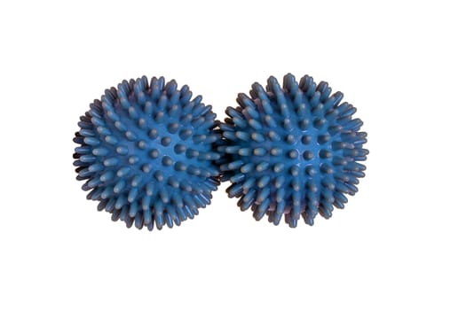 Massage ball or hedgehog ball. Closeup of two spiky massage balls for health therapy isolated on a white background. Therapy and fitness equipment.