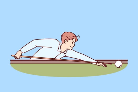 Man plays billiards leaning over table with cue in hands and taking aim, to put ball into hole. Guy is professional athlete playing billiards participating in competitions with cash prize