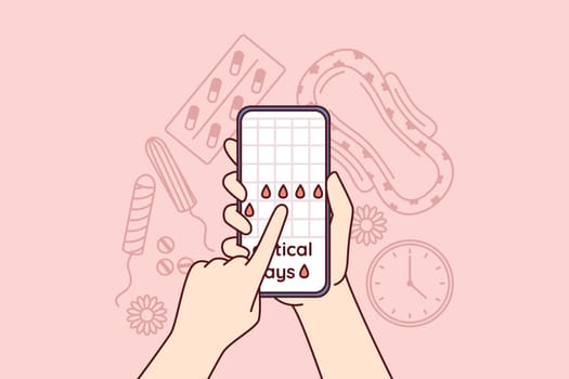 Menstruation cycle calendar in mobile phone in hands near pads and tampons or feminine hygiene products and pain pills. Planning menstruation or critical days using website for girls
