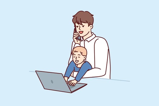Young father freelancer with baby in arms works with laptop and makes phone call during quarantine restrictions. Father with little boy does remote work and is raising son at same time
