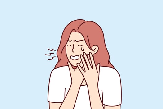 Woman suffering from toothache crying holding cheek needs help from qualified dentist from dental clinic. Girl is experiencing toothache due to inflammation of gums or stomatitis and caries