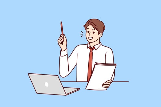 Businessman is sitting at table with laptop raising pen up participating in webinar on management. Guy student with notebook in hand raises hand wishing to become successful businessman