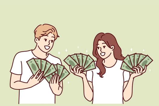 Man and woman with lot of cash in hands brag about money they earned from business or winning jackpot in lottery. Couple rich guys girls with money want to invest savings or invest in startup