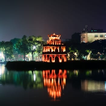 Nighttime view of a pagoda in Hoan Kiem Lake park