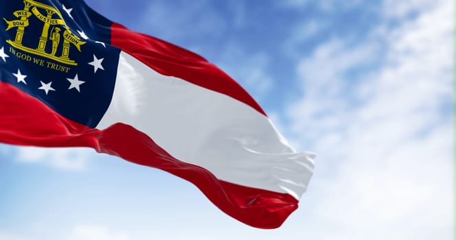 The state flag of Georgia waving in the wind on a clear day. Georgia is a state in the southeastern US. US federate state. 3d illustration render. Selective focus. Fluttering textile