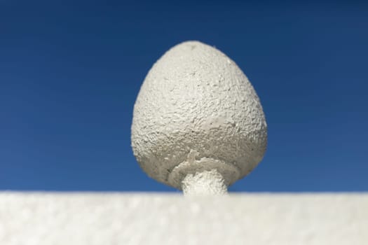 Detail of old architecture of hedge. White fence. Stone architecture.