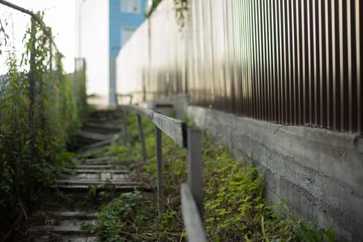 Fence made of steel. Steel fence profile. Private territory. Details of fence.