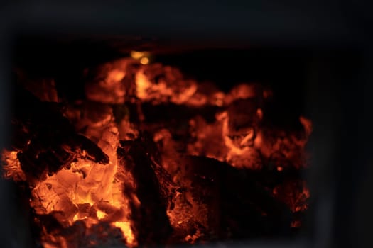 Fire flame. Flame texture. Burning firewood in stove. Fuel in hearth.