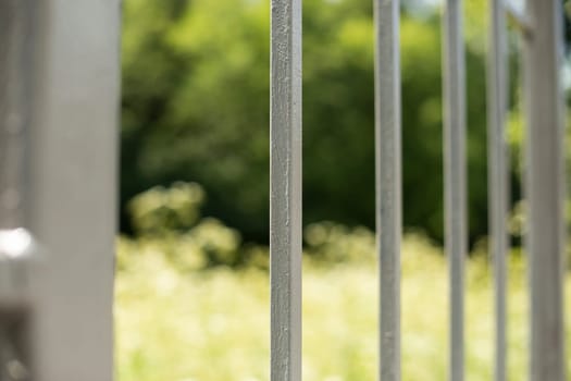 Fence in detail. Fence around house. Barrier for outsiders. Private territory.
