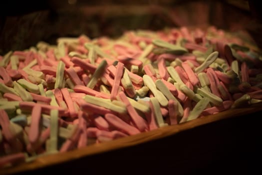 Sweets on wind. Chewing gum in box. Lots of candy in drawer. Details of sale of sweet goods.