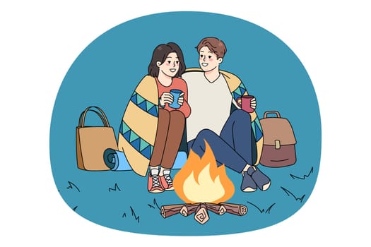 Happy couple sit near fire hugging cuddling drink warm tea or coffee enjoy romantic date outside. Smiling man and woman relax on evening nature weekend together. Romance. Vector illustration.
