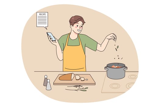 Smiling man cooking soup at home kitchen follow recipe on smartphone screen. Happy male chef prepare delicious food for dinner with online instruction on cellphone. Vector illustration.