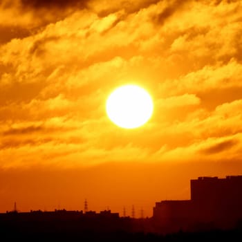 city sunset golden sun in sky