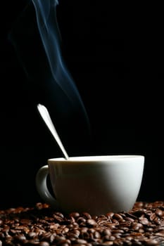 coffee beans and white hot cup of drink