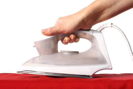 girl hand have to iron red material