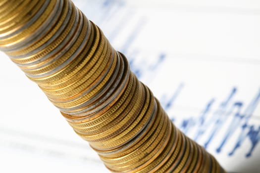 coins and financial graph on background