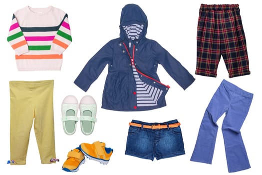 Collage set of girl spring summer clothes isolated. Female kids apparel collection. Child baby fashion clothing outfit. Colorful stylish jacket, sweater, pants, shorts, shoes wearing.