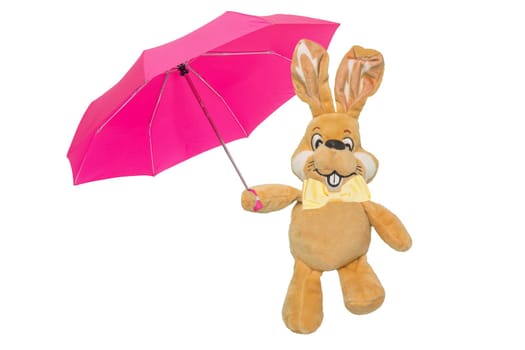 A cute brown plush bunny or rabbit with bow tie and pink umbrella isolated on white. Easter greeting card decoration element with space for design. Bright plush toy.