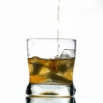 whisky splash alcohol drops isolated on white