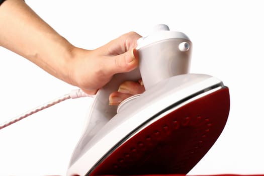 girl hand have to iron red material