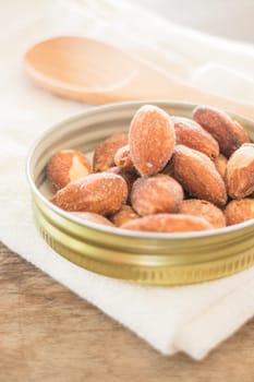Almond grain roast salt on weathered wooden table, stock photo