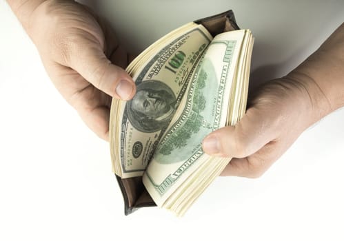 Opening the wallet full of money.