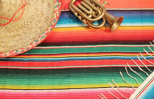 striped poncho serape sombrero fiesta background with copy space background