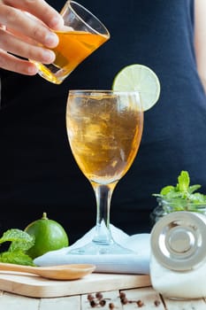 closeup hand mix tea lemon and honey healthy drink