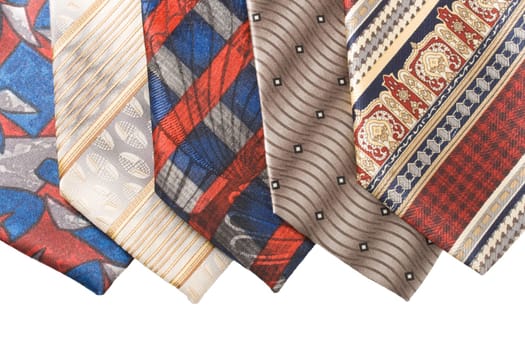 Selection of multicolored ties on white background