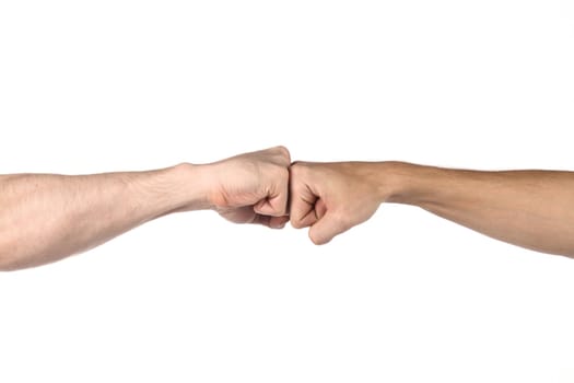 Two fists beat each other meet in a point