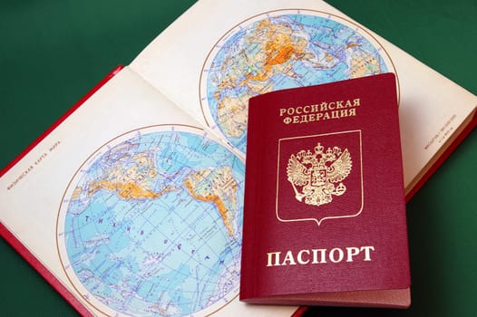 The Foreign passport of the person to Russian Federation and card of the world.