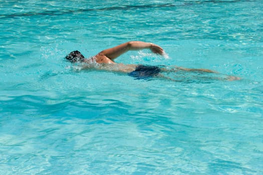 Swimming young man (the crawl)