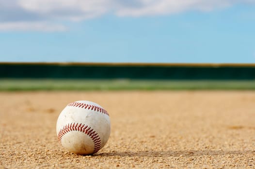 one baseball on infield of sport field
