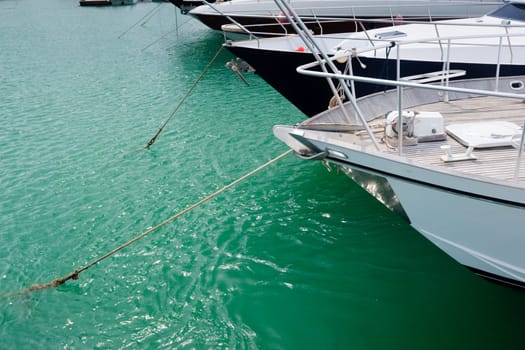Bow of sailing boats moored in marina at Greece