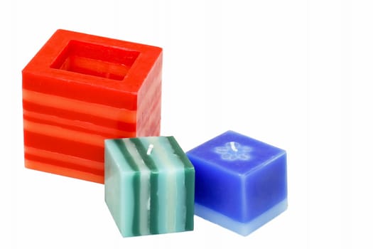 Three colorful decorative candles isolated on white