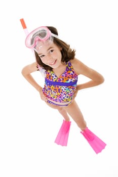 Caucasian child posing in a swimsuit standing on white background