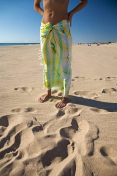 woman with beach wrap at el palmar beach in cadiz spain