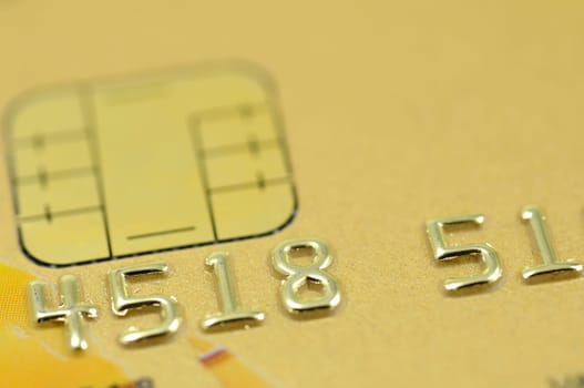 Close up of golden credit card with chip