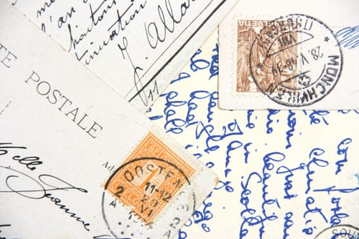 Old postcards with handwriting and stamps from Belgium and Helvetia.