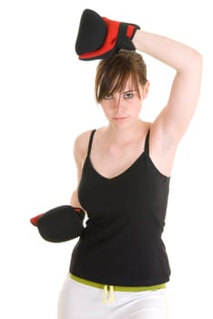 Teenage girl with black and white outfit, wearing boxing gloves, in various positions for boxing or martial arts.