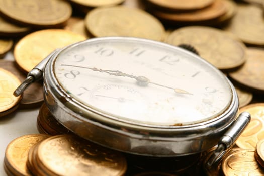 time is money coins and clock macro concet