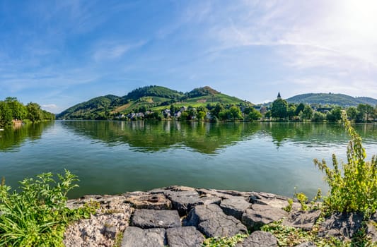 A beautiful view from Alf in the district of Cochem-Zell in Rhineland-Palatinate across the Moselle to Bullay in bright sunshine.